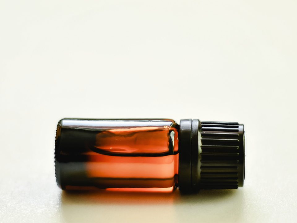 Cardamom extract, an amber liquid in a small glass bottle