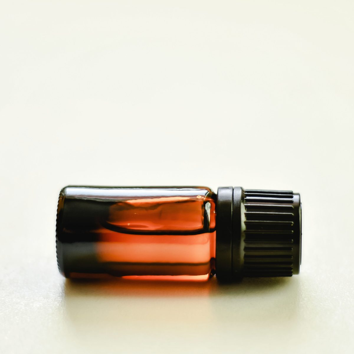Cardamom extract, an amber liquid in a small glass bottle