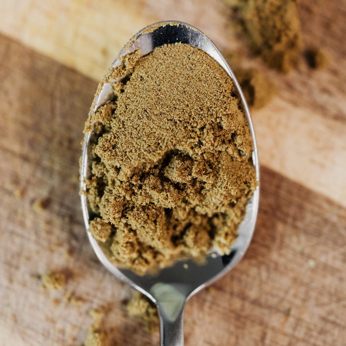 Ginger powder, a buff fine powder on a metal spoon
