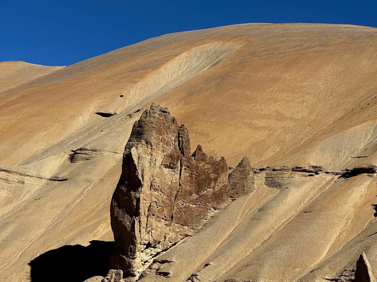 A rock outcrop on a high Himalayan slope, the terrain in which shilajit forms