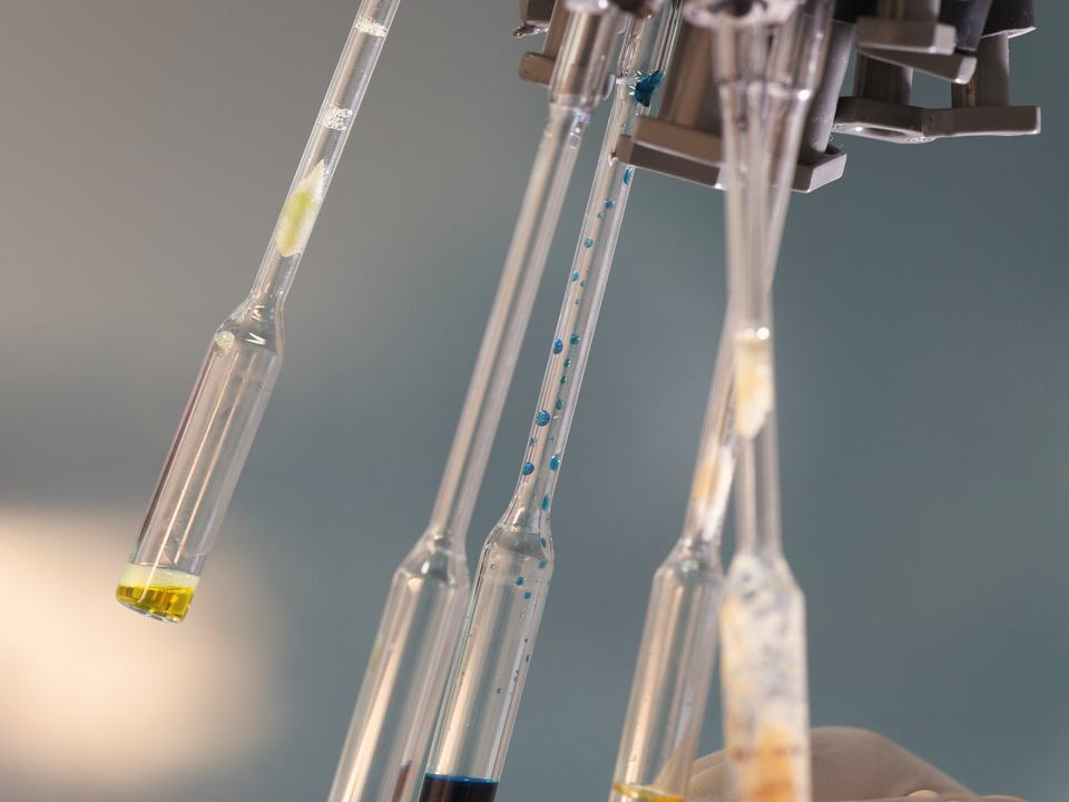 Sample vials being checked in a quality control laboratory